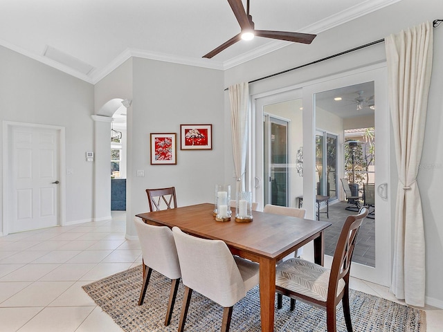 dining space with light tile patterned floors, ceiling fan, and ornamental molding