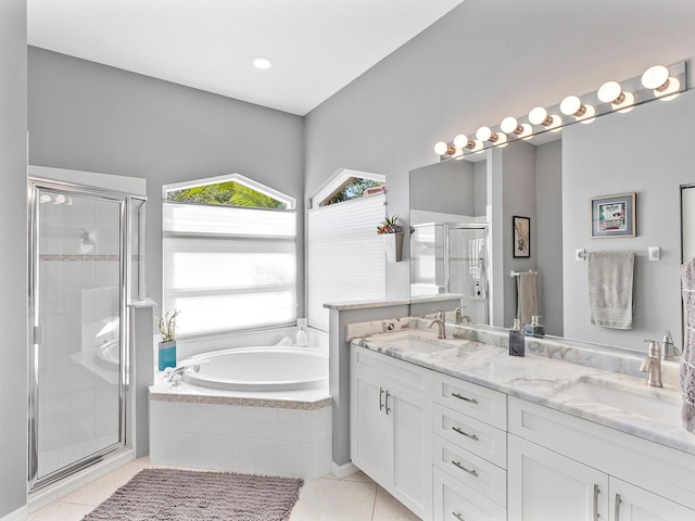 bathroom featuring separate shower and tub, tile patterned flooring, and vanity