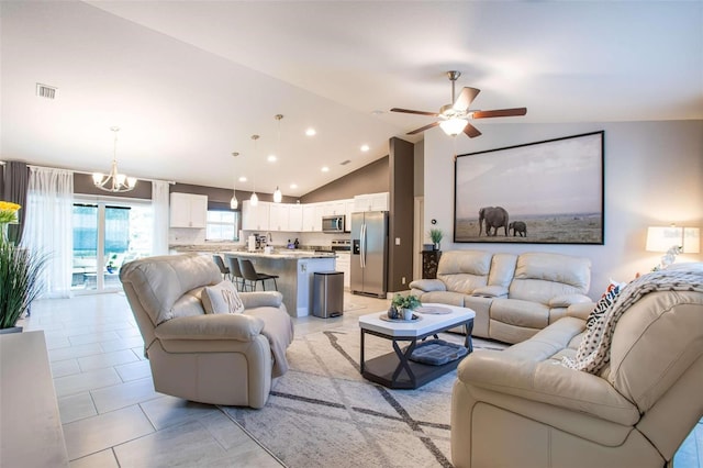 tiled living room featuring ceiling fan with notable chandelier and high vaulted ceiling