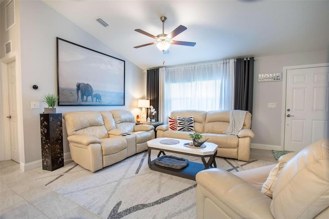 living room featuring ceiling fan and vaulted ceiling