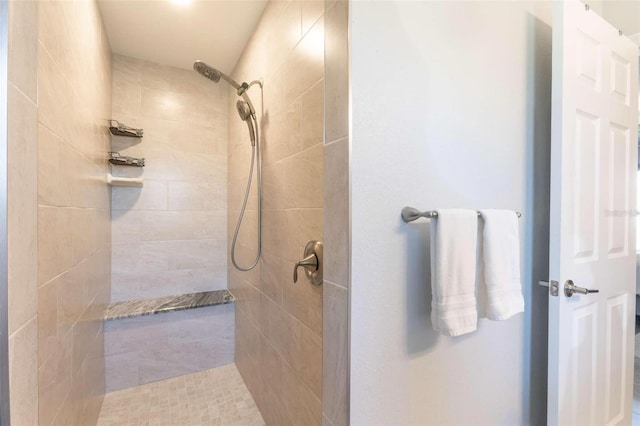 bathroom featuring a tile shower