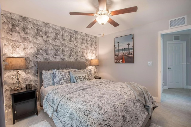 bedroom with ceiling fan and light wood-type flooring