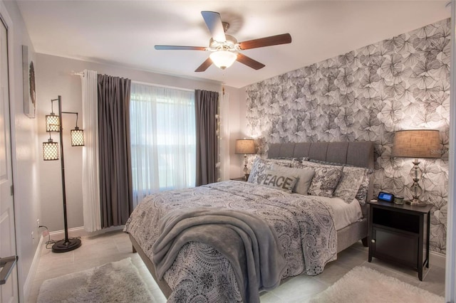 tiled bedroom with ceiling fan