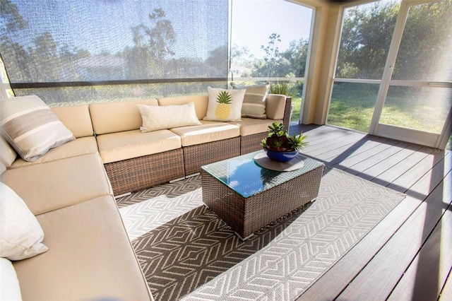 sunroom / solarium featuring a healthy amount of sunlight