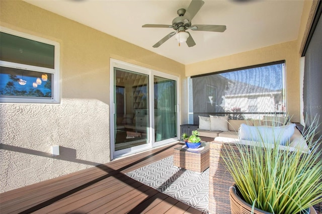 exterior space featuring ceiling fan