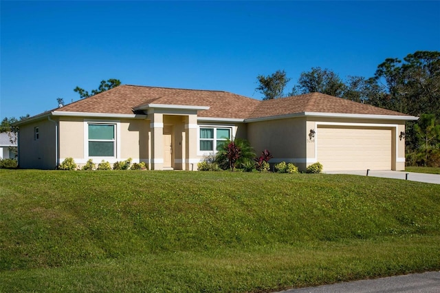 ranch-style house with a garage and a front yard