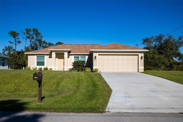 single story home with a front lawn and a garage