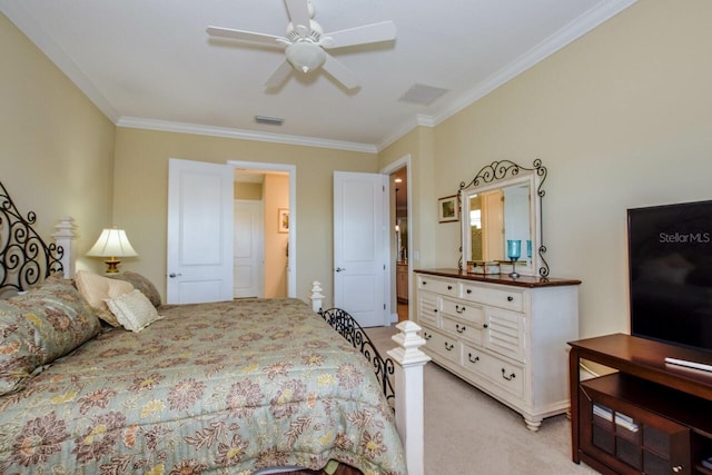 carpeted bedroom featuring ceiling fan and crown molding