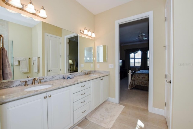 bathroom featuring tile patterned flooring, ceiling fan, and vanity