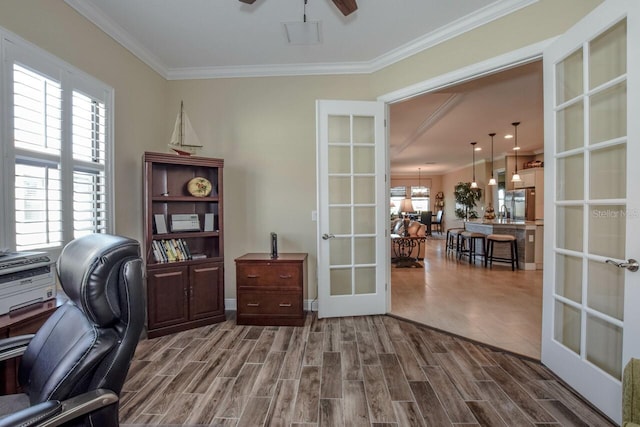 office area featuring hardwood / wood-style flooring, ceiling fan, crown molding, and french doors