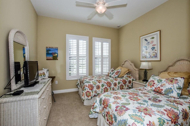 bedroom with ceiling fan and light colored carpet