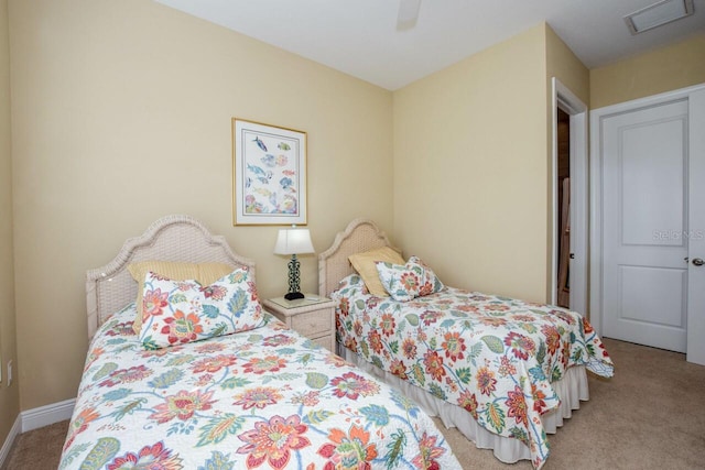 bedroom featuring light carpet and ceiling fan