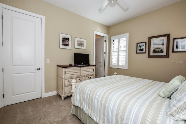 carpeted bedroom featuring ceiling fan