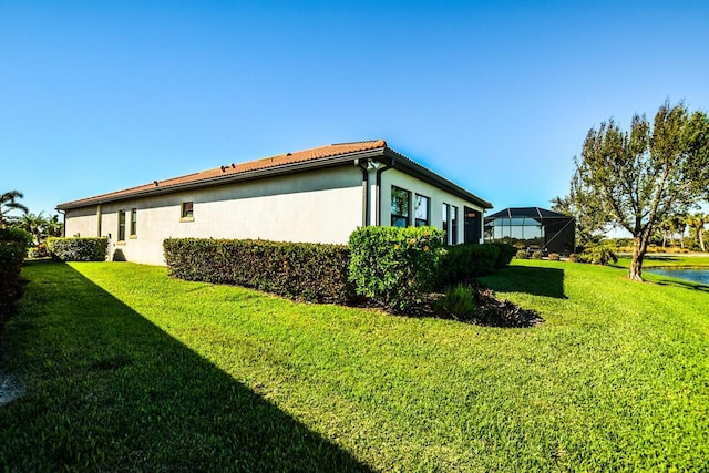 view of home's exterior with a yard