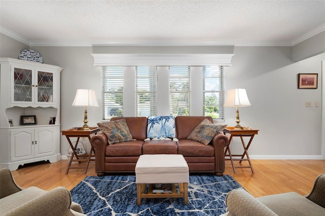 living room featuring plenty of natural light, wood-type flooring, and ornamental molding