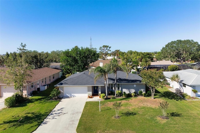 view of front of house featuring a garage and a front lawn