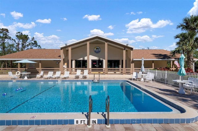 view of swimming pool with a patio