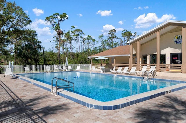 view of swimming pool featuring a patio area