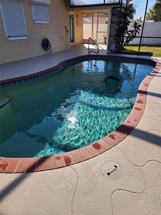 view of swimming pool featuring a patio area