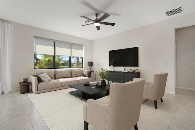 tiled living room with ceiling fan