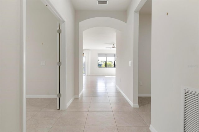 hallway with light tile patterned floors