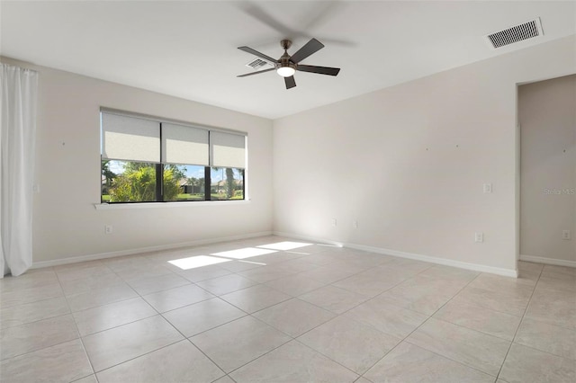 tiled empty room with ceiling fan