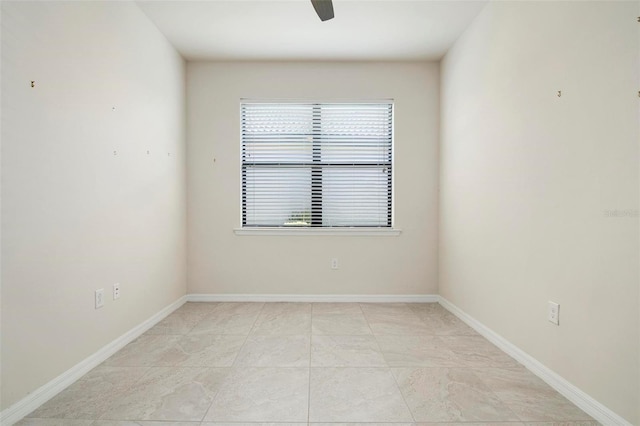 spare room with ceiling fan