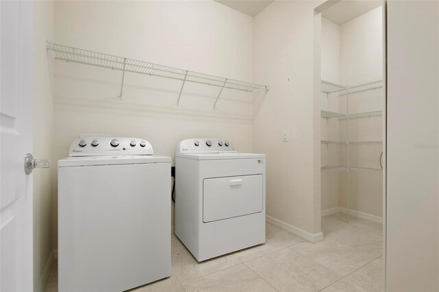 laundry area with separate washer and dryer