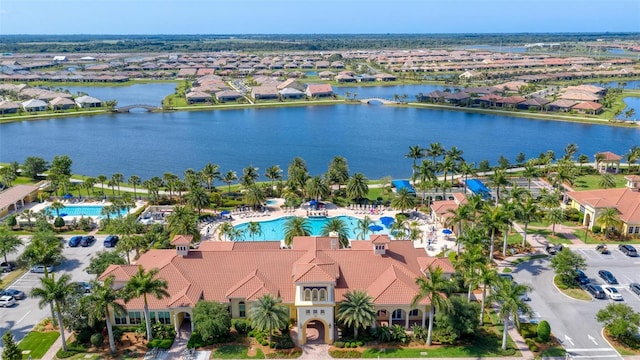 birds eye view of property with a water view