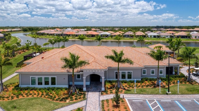 birds eye view of property with a water view