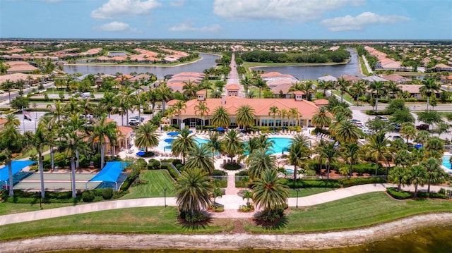 birds eye view of property with a water view