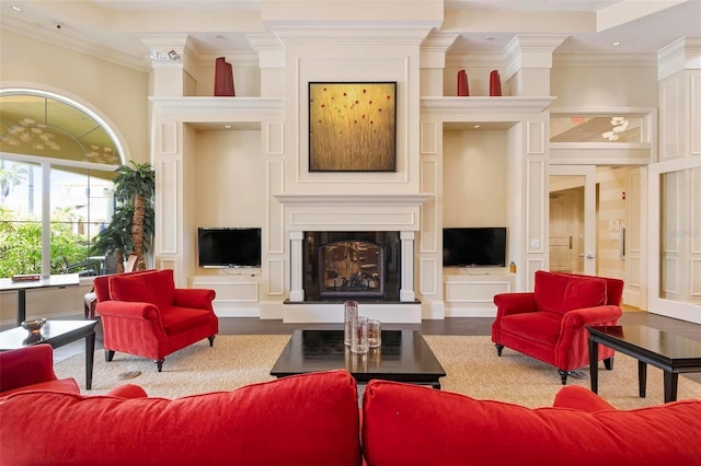 living room featuring wood-type flooring and crown molding