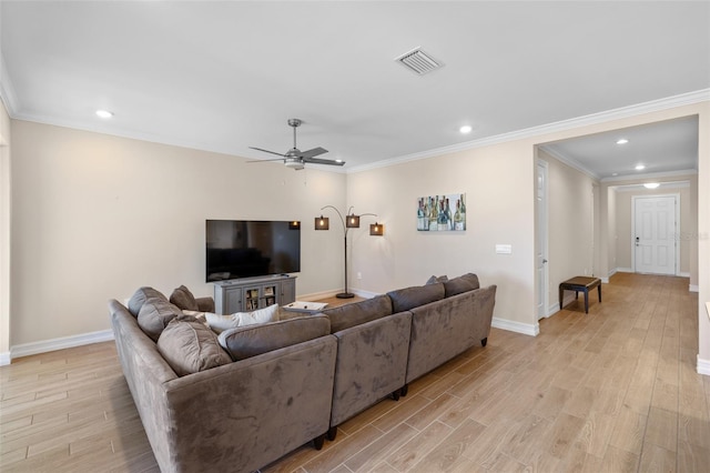 living room featuring ceiling fan, crown molding, and light hardwood / wood-style floors