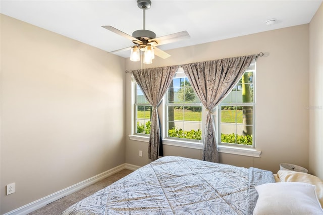 bedroom featuring ceiling fan and carpet floors