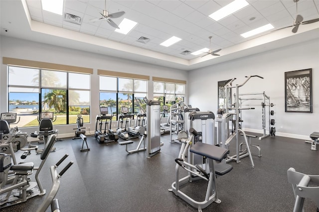 660 Ravello Blvd, Nokomis, FL 34275 - gym with a ceiling fan, a paneled ceiling, baseboards, and a tray ceiling