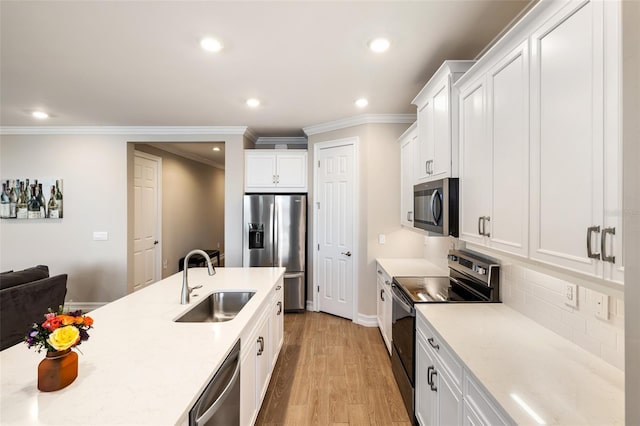 660 Ravello Blvd, Nokomis, FL 34275 - kitchen featuring stainless steel appliances, a sink, ornamental molding, recessed lighting, and decorative backsplash