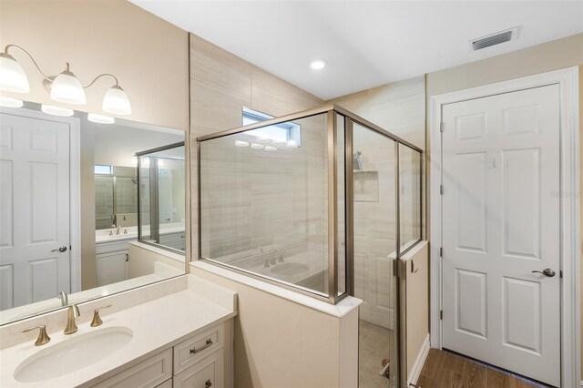 660 Ravello Blvd, Nokomis, FL 34275 - full bath with vanity, a shower stall, and wood finished floors