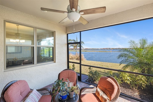 660 Ravello Blvd, Nokomis, FL 34275 - sunroom with a water view, a ceiling fan, and a chandelier