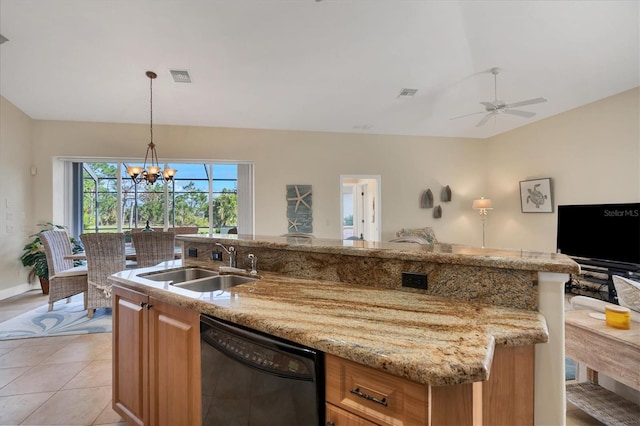 kitchen with light stone countertops, dishwasher, sink, hanging light fixtures, and light tile patterned floors