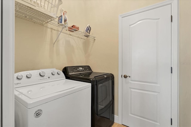 laundry area with independent washer and dryer