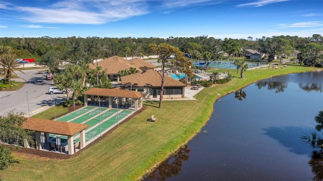 birds eye view of property with a water view