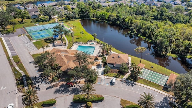 birds eye view of property with a water view