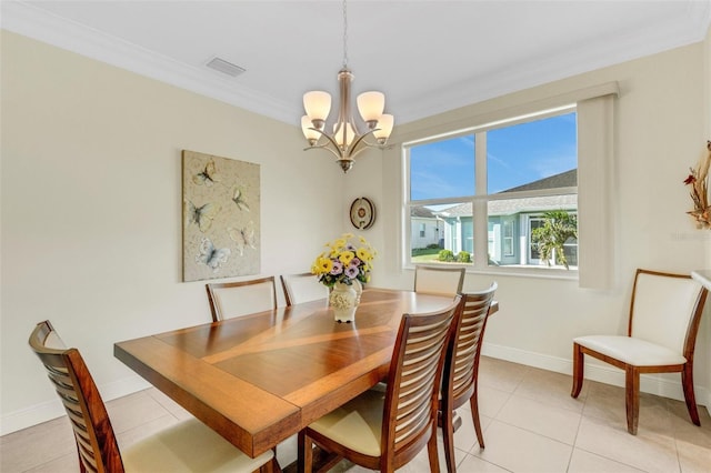 tiled dining room with crown molding and an inviting chandelier