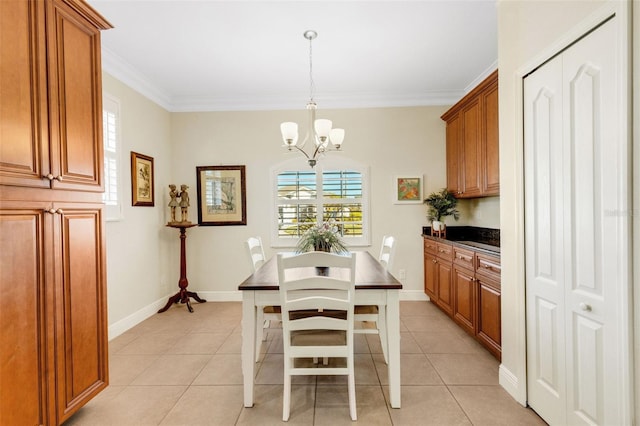 tiled dining area with crown molding and a notable chandelier