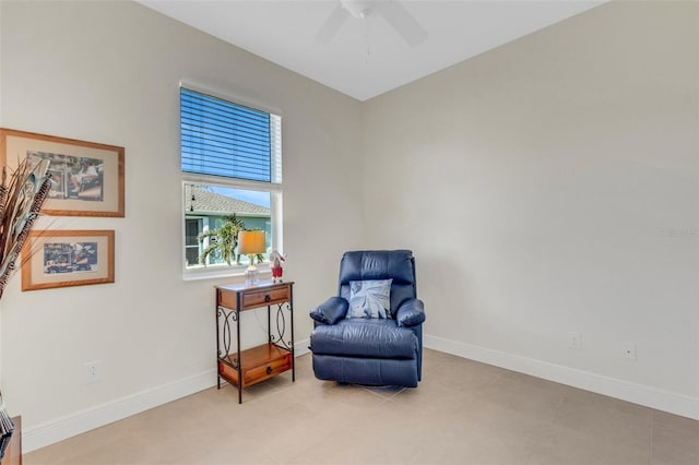 living area featuring ceiling fan