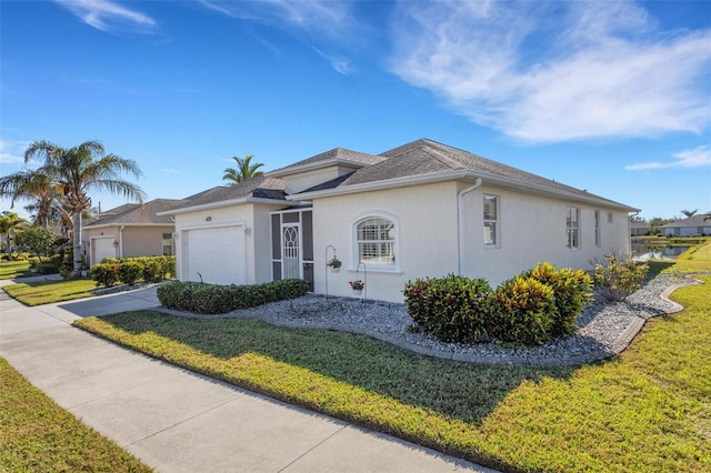 ranch-style house with a garage and a front lawn