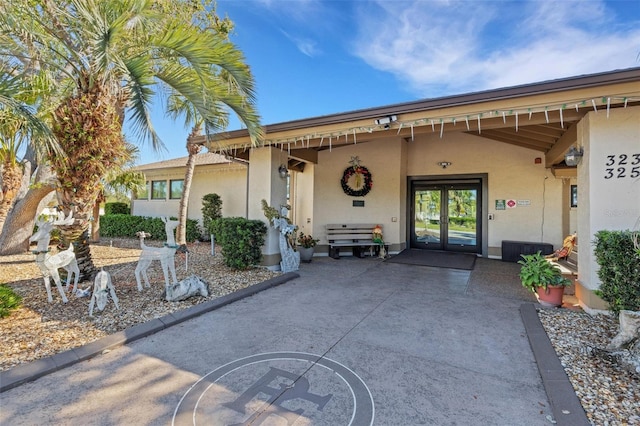 property entrance featuring french doors