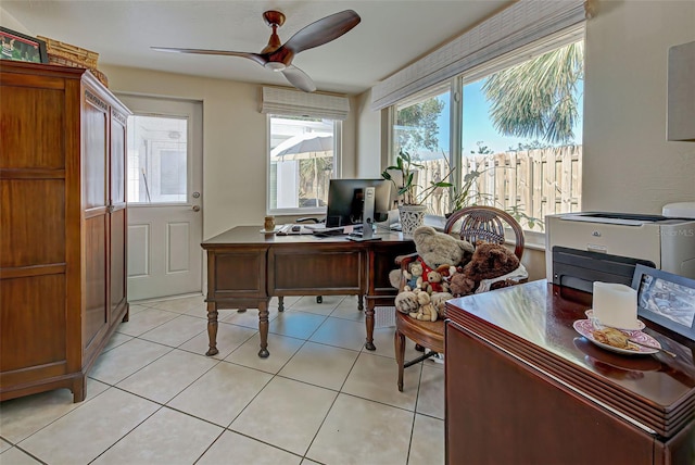 tiled office featuring ceiling fan