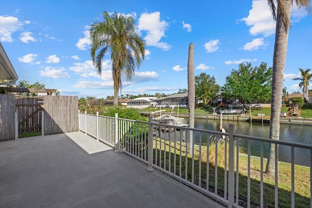 balcony featuring a dock and a water view