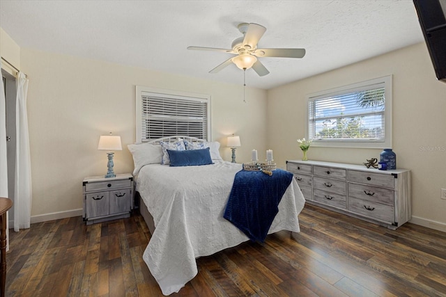 bedroom featuring dark hardwood / wood-style flooring and ceiling fan